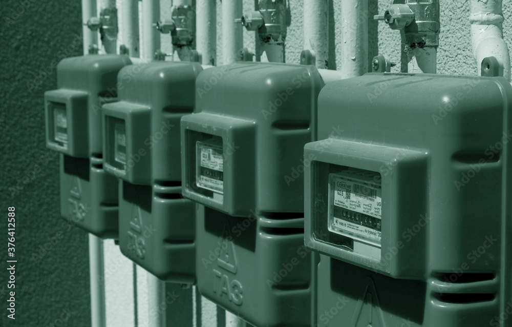 ODESSA, UKRAINE - August 15, 2018: Number of new meters of natural gas on outer wall of residential building. New meters for measuring natural gas consumption in households. Inscription: 
