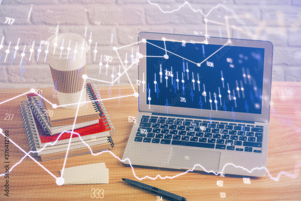Double exposure of chart and financial info and work space with computer background. Concept of international online trading. Double exposure of chart and financial info and work space with computer background. Concept of international online trading.