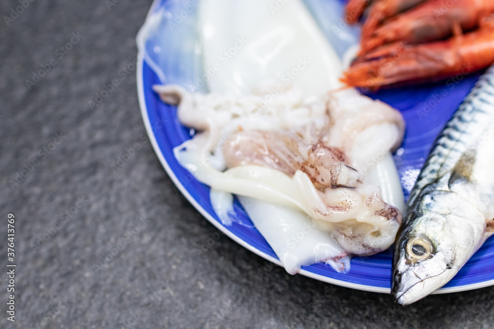 mackerel, red prawns and squid. Raw fish rich in omega 3 ready to be cooked. Mediterranean diet and fish. Cuisine, ingredients and fresh fish dishes mackerel, red prawns and squid. Raw fish rich in omega 3 ready to be cooked. Mediterranean diet and fish. Cuisine, ingredients and fresh fish dishes