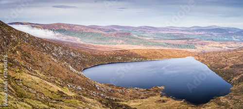 Panoramic view on heart shaped lake, Lough Ouler and Tonelagee mountain with Wicklow hills in background, Ireland