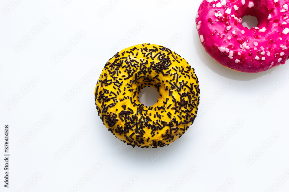 pink and yellow doughnut with sprinkles isolated pink and yellow doughnut with sprinkles isolated