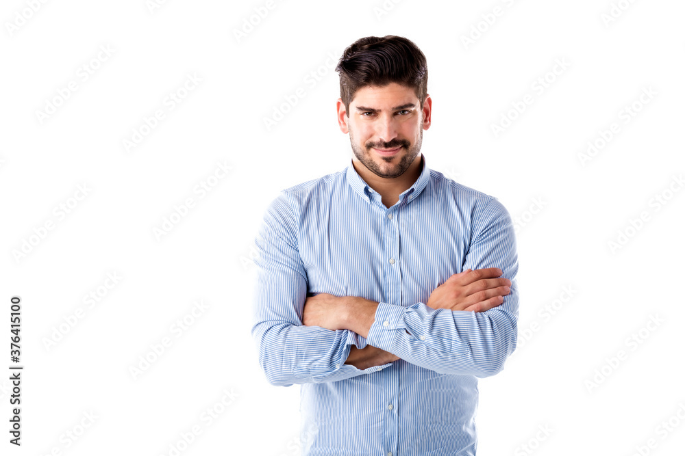 Smiling businessman standing with arms crossed at isolated white background Smiling businessman standing with arms crossed at isolated white background