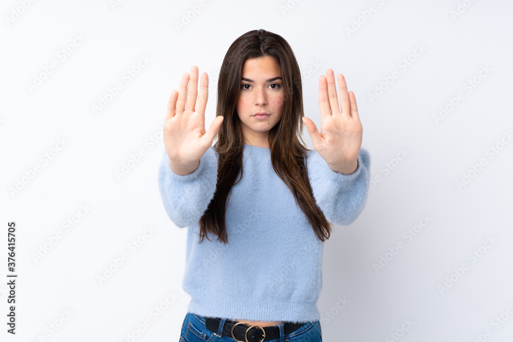 Young teenager Brazilian girl over white background Young teenager Brazilian girl over white background