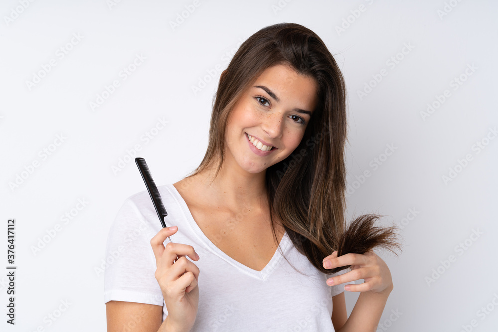Young teenager Brazilian girl over white background Young teenager Brazilian girl over white background