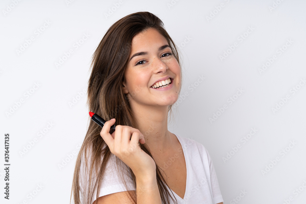 Young teenager Brazilian girl over white background Young teenager Brazilian girl over white background