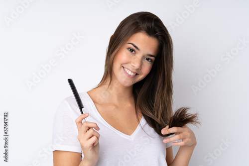 Young teenager Brazilian girl over white background
