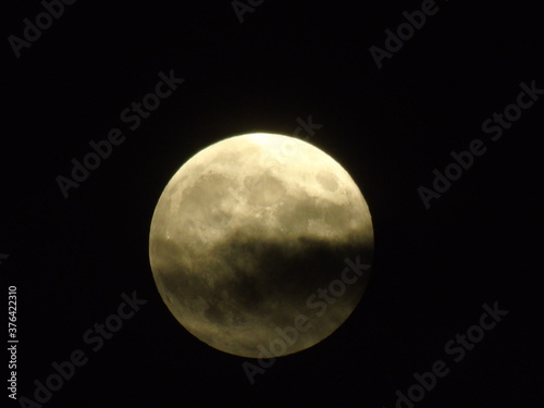 full moon in cloudy night sky