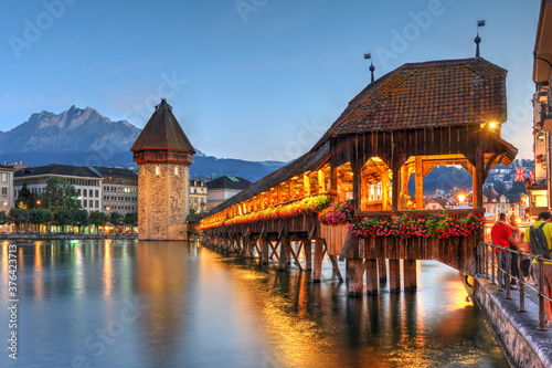 Chapel Bridge and Mount Pilatus in Luzern (Lucerne), Switzerland photo