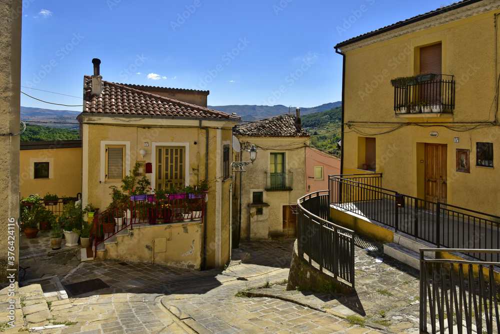 A small road crosses the old buildings of Calvello, a old Town in the Basilicata region, Italy.
