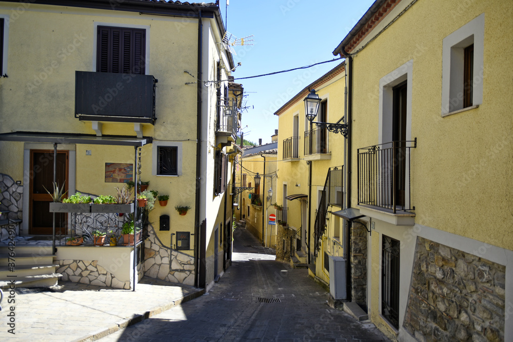 A small road crosses the old buildings of Calvello, a old Town in the Basilicata region, Italy.