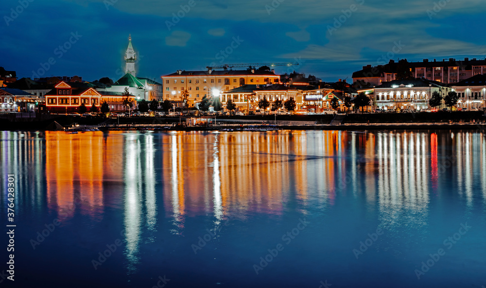 A view of Old Tatar district in Kazan at night. Reflection of lights in water.
