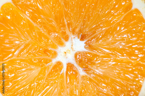 Orange close-up macro. Juicy fruit cut in half.