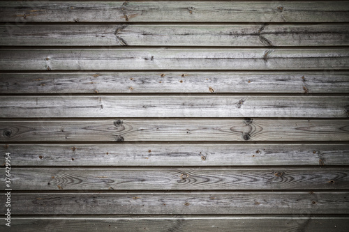 Grungy weathered wooden wall background texture