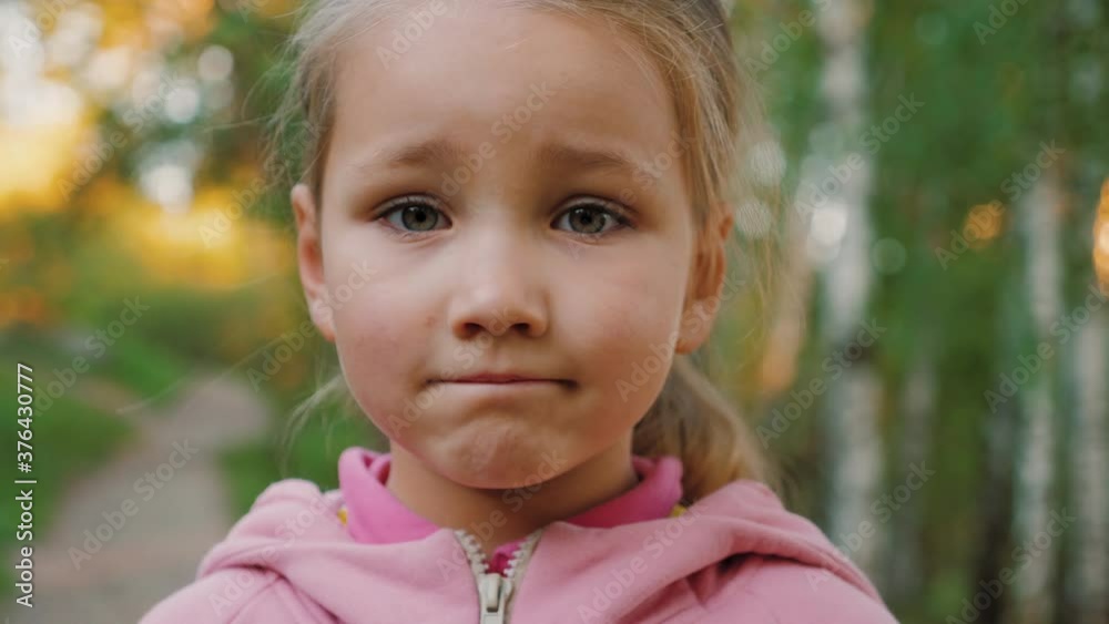 Portrait of sad little girl looking at camera Portrait of sad little girl looking at camera