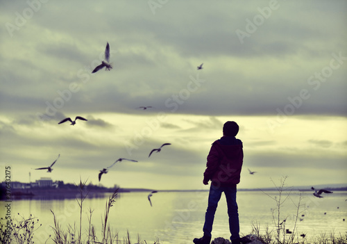 silhouette of a man with a kite