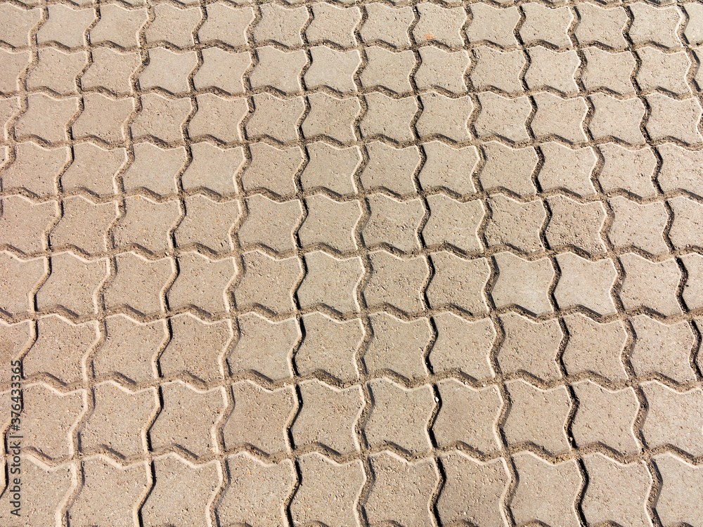 Sidewalk tile. Close-up paving slabs by mosaic. Road paving, construction. Colored concrete paving slab. Diagonal. Sidewalk tile. Close-up paving slabs by mosaic. Road paving, construction. Colored concrete paving slab. Diagonal.