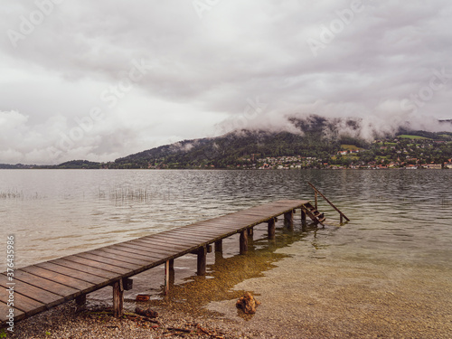 Promenade on the beach of Bad Wiessee in Upper Bavaria in Germany. Swimming and diving platform in the lake of tegernsee