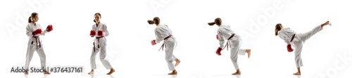 Inspiration. Junior in kimono practicing taekwondo combat, martial arts. Young female fighter with red gloves training on white studio background in motion, dymanic. Concept of healthy lifestyle