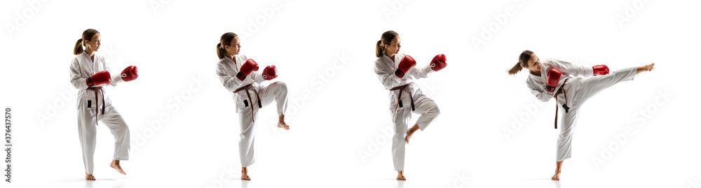 Tensioned. Junior in kimono practicing taekwondo combat, martial arts. Young female fighter with red gloves training on white studio background in motion, dymanic. Concept of healthy lifestyle, action Tensioned. Junior in kimono practicing taekwondo combat, martial arts. Young female fighter with red gloves training on white studio background in motion, dymanic. Concept of healthy lifestyle, action