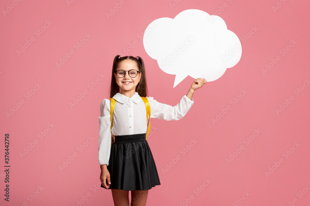 Got an idea. Smiling schoolgirl in uniform with backpack holding abstract bubble Got an idea. Smiling schoolgirl in uniform with backpack holding abstract bubble