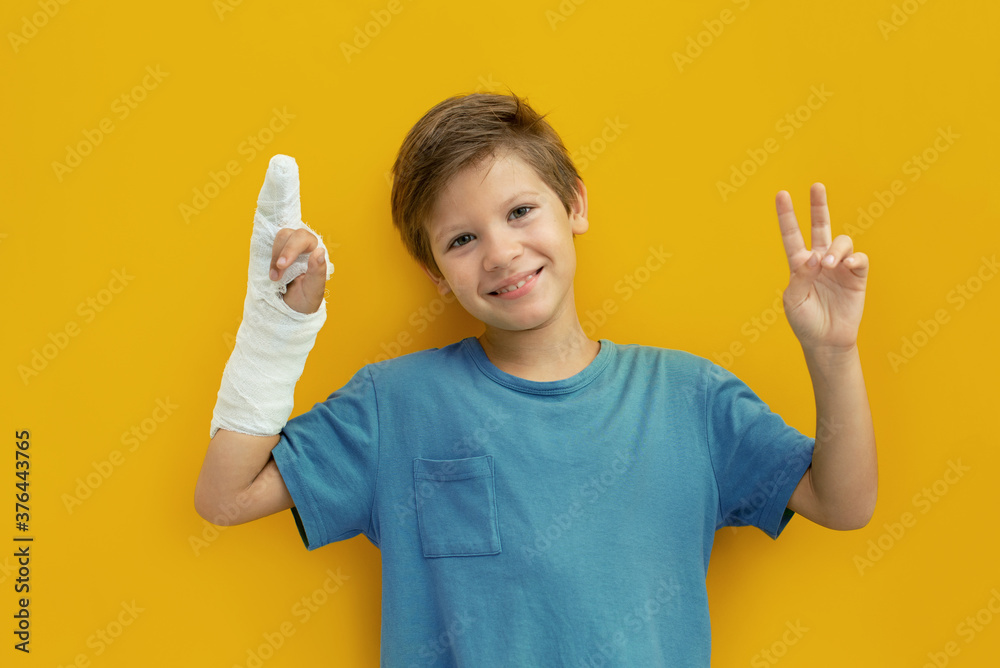 A child with a plaster on his hand. Copy space A child with a plaster on his hand. Copy space