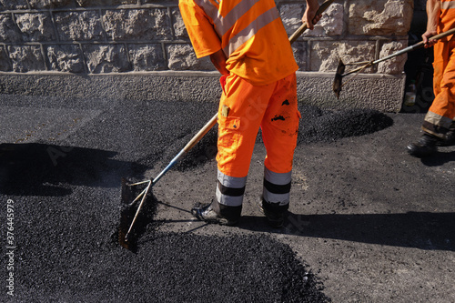 Paving the road with porous asphalt for traffic noise.reduction in Geneva, switzerland photo