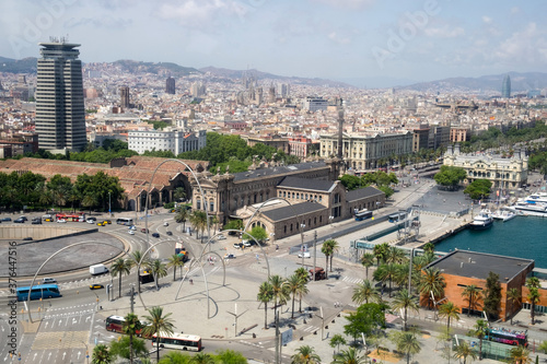 The panorama, urban cityscape of Barcelona, Spain, and the coastline of Mediterranean sea taken from the cable car of the teleferic cableway leading from the Barcelona port to Montjuic mountain 