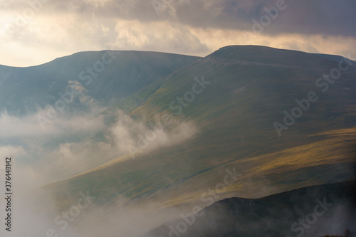 Mountains with mist and clouds in the morning