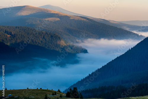Mountains with mist and clouds in the morning