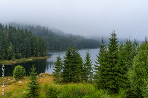 Lake in the mountains on a foggy day