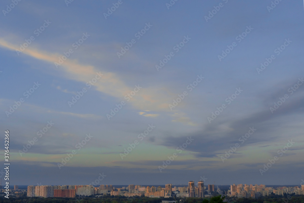blue evening sky over eastern European city. calm evening sky over the city in summer