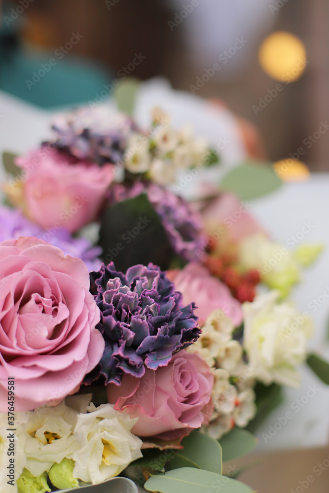 Beautiful bouquet of mixed flowers in man's hands. The work of the florist at a flower shop. Delicate bright color. Fresh cut flower. Beautiful bouquet of mixed flowers in man's hands. The work of the florist at a flower shop. Delicate bright color. Fresh cut flower.
