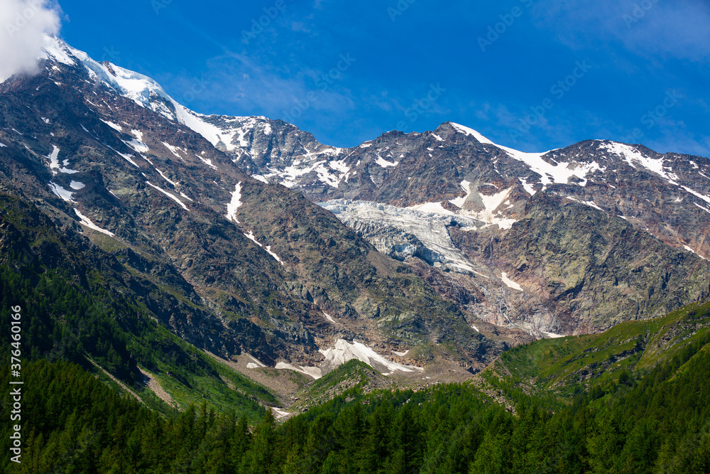 Picturesque views from Simplon Pass of rocky landscape of Swiss Alps on sunny summer day.