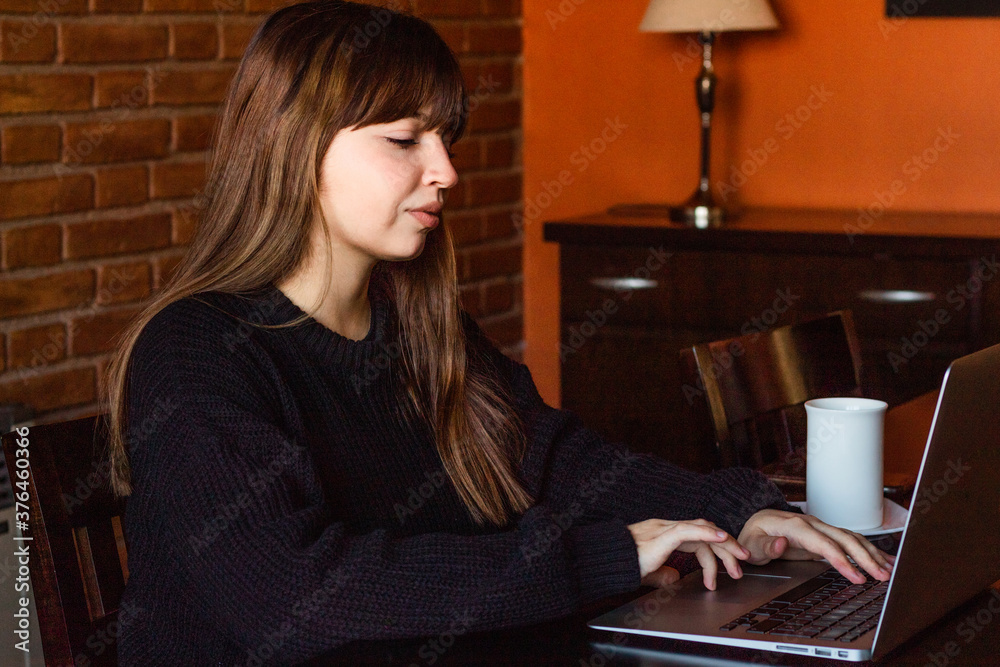Beautiful student girl working happy in laptop.