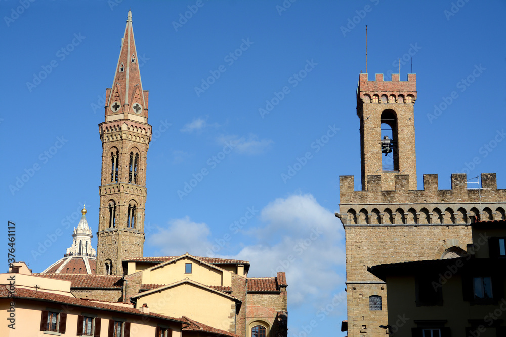 The beautiful San Firenze square in Florence with the palaces of the Renaissance, the bell tower of the Florentine Badia. 