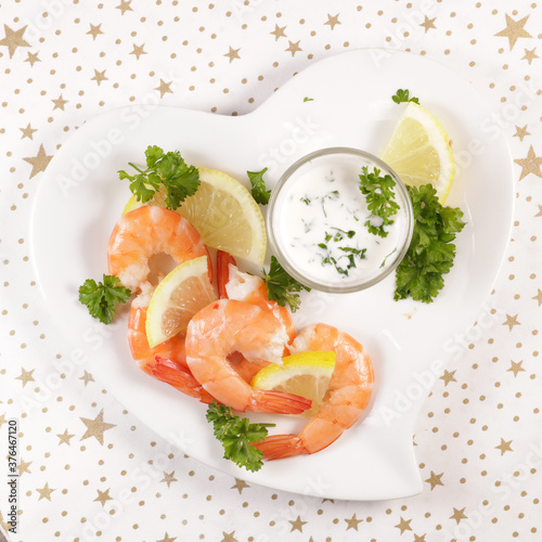 shrimp snack with fresh yogurt sauce and herbs