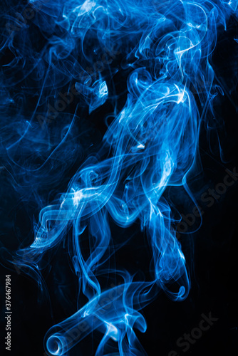 Blue abstract shaped smoke against black background. Abstract background