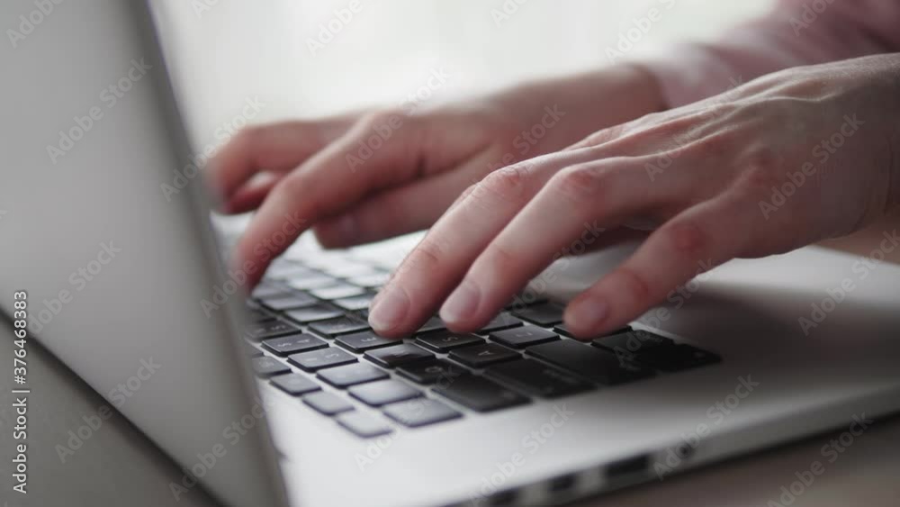 Closeup of hands of business person typing on laptop keyboard at the desk in home office. Closeup of female hands working on laptop keyboard. Businesswoman using laptop. Closeup of hands of business person typing on laptop keyboard at the desk in home office. Closeup of female hands working on laptop keyboard. Businesswoman using laptop.