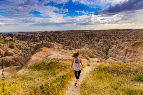 Woman hiking her way through the scenic Badlands, South Dakota