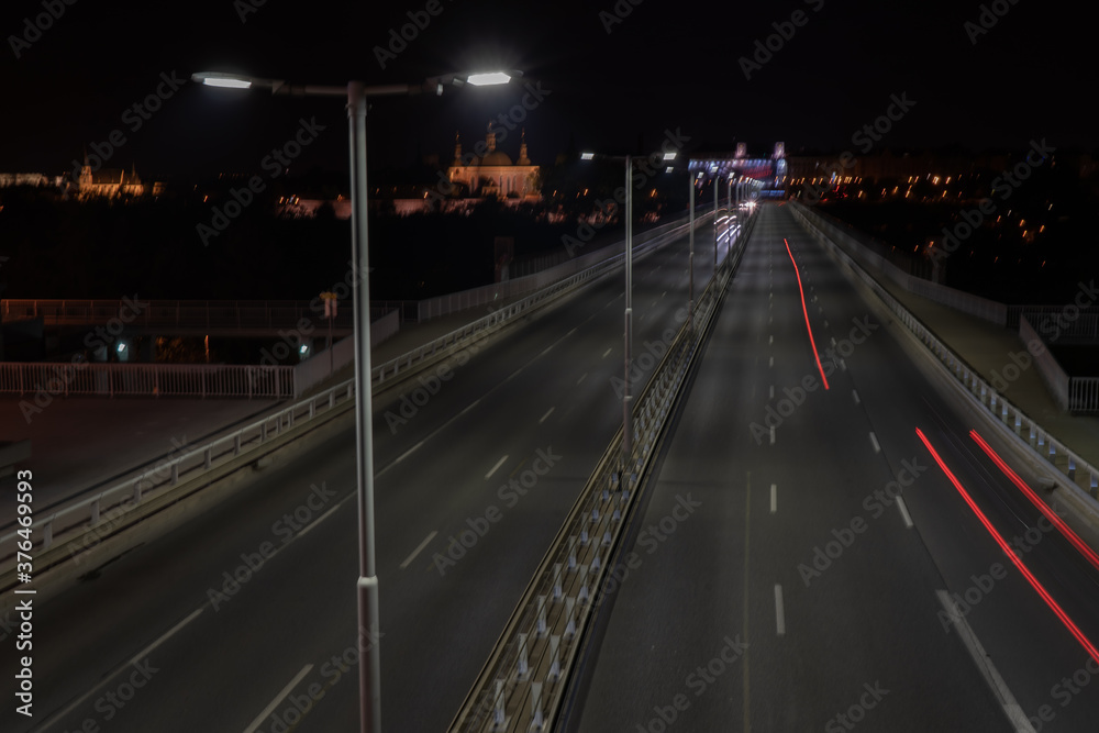 light from street lights and reflections of lights on the road in the center of the old town of Prague at night in the Czech Republic light from street lights and reflections of lights on the road in the center of the old town of Prague at night in the Czech Republic
