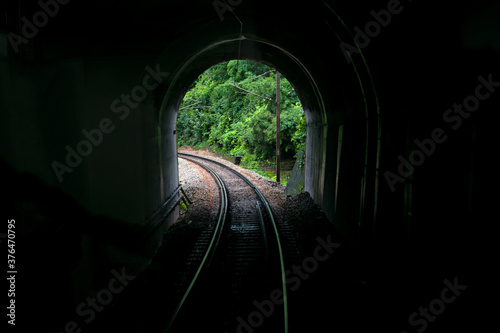 Image taken from vista-dome tourist coach of a tunnel portal with railway line.