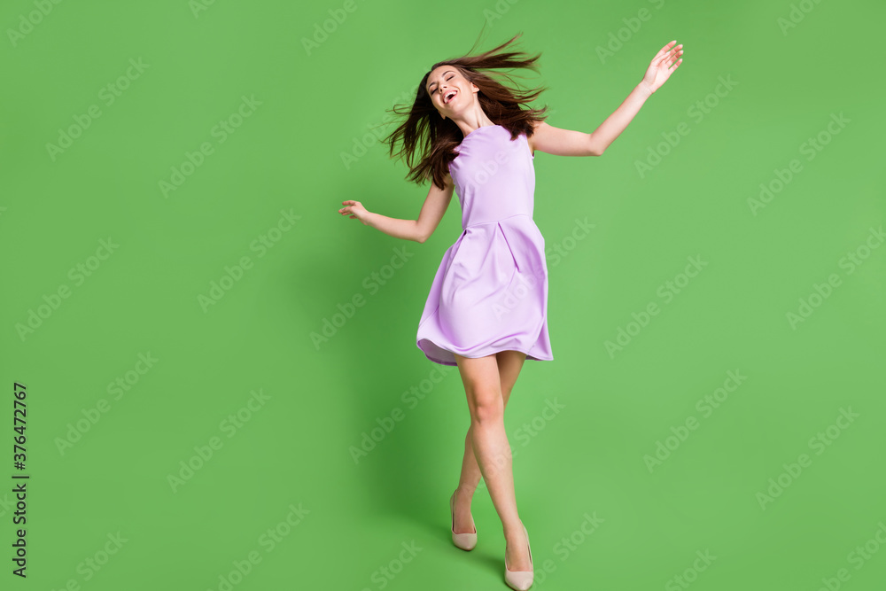 Full length body size view of her she nice-looking attractive charming lovely glad slender thin cheerful cheery girl having fun enjoying free time walking chill isolated green color background Full length body size view of her she nice-looking attractive charming lovely glad slender thin cheerful cheery girl having fun enjoying free time walking chill isolated green color background