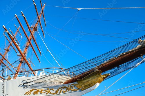 Photos Low angle view of a classic white sailing ship with masts, yards, bowsprit and figurehead, starboard side