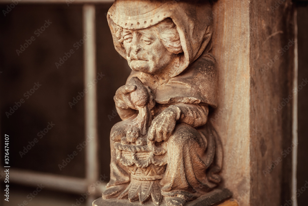 Older market seller sculpture on wall of the15th century Rathaus building. Bremen.