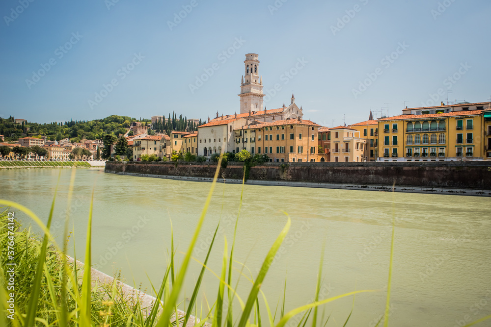 Fototapeta premium View of the Duomo in Verona looking above the Adige river on a sunny day with no clouds.