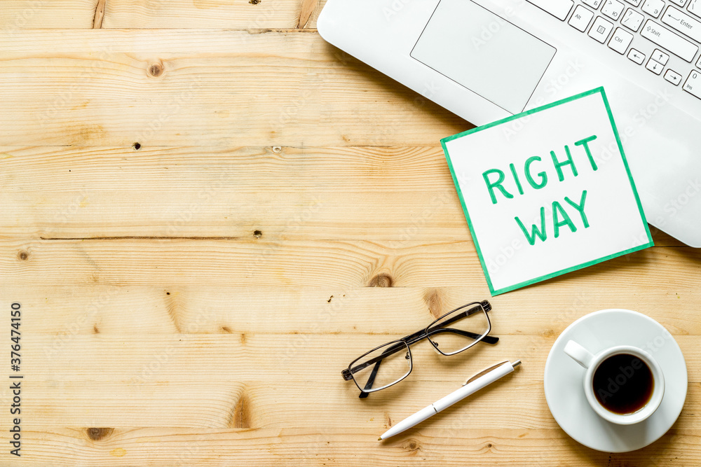 Right way icon on wooden office desk top view copy space Right way icon on wooden office desk top view copy space