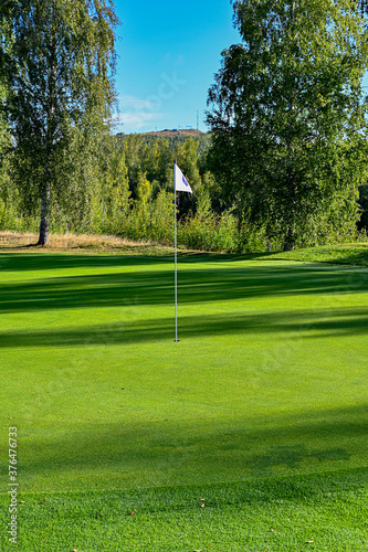 shadows over a golf green in Sweden