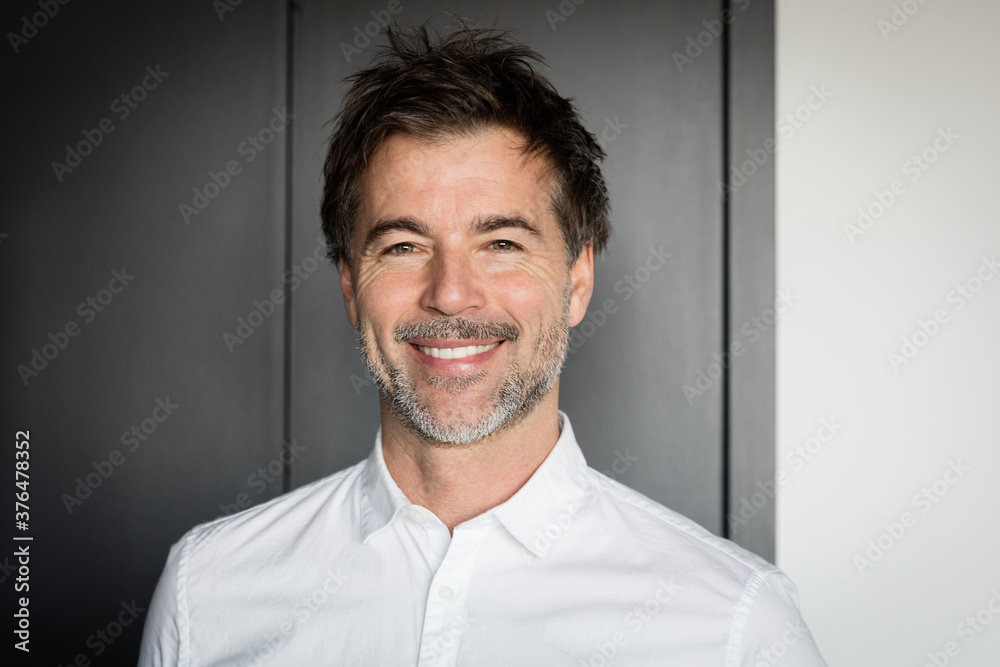 Handsome smiling man relaxing at the hotel Handsome smiling man relaxing at the hotel
