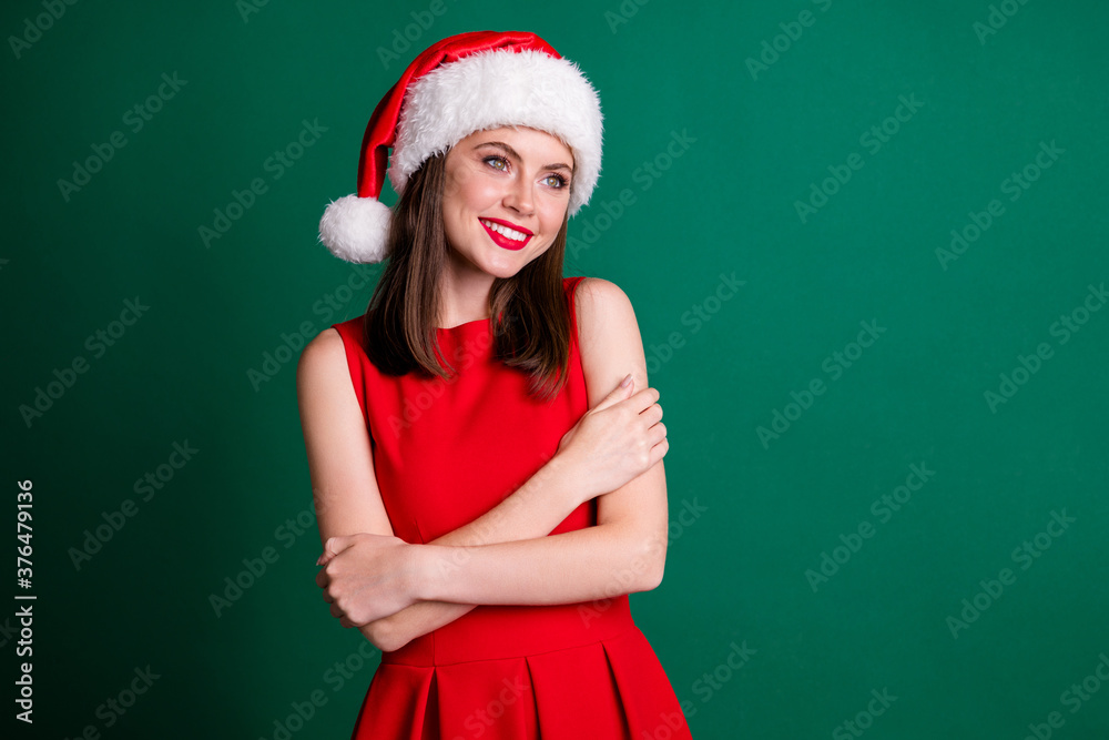 Photo of attractive adorable lady model newyear x-mas party 2021 hug herself dreamy look evergreen tree wear santa cap red mini dress costume isolated green pastel dark color background Photo of attractive adorable lady model newyear x-mas party 2021 hug herself dreamy look evergreen tree wear santa cap red mini dress costume isolated green pastel dark color background