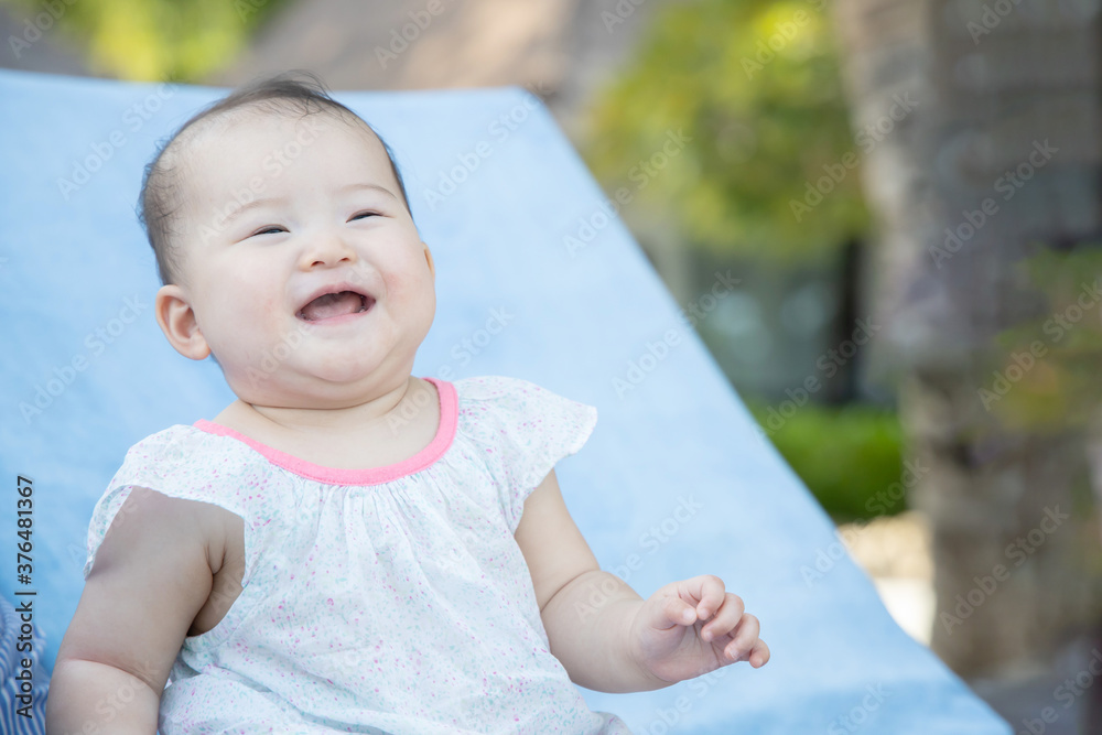 View of Smile Asian Baby on a Chair View of Smile Asian Baby on a Chair